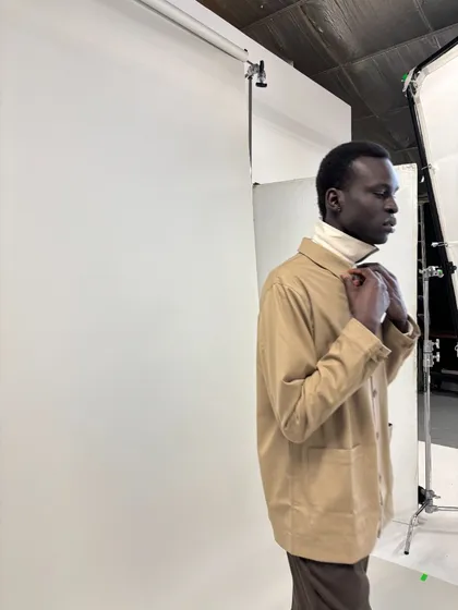 Content & Motion — Beige jacket, studio cove